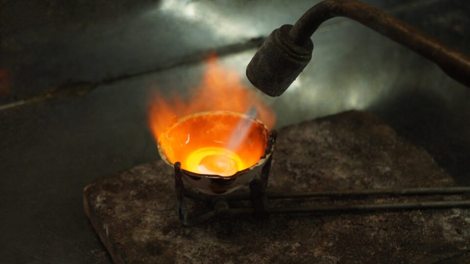 a crucible within which the dross is converted into gold