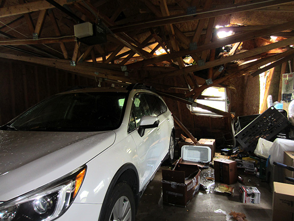 garage interior before roof was cleared